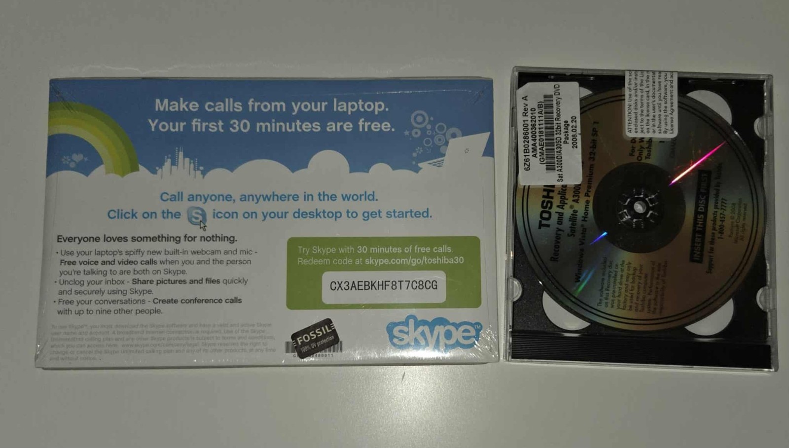 promotional card for Skype and a Toshiba Windows Vista recovery DVD.